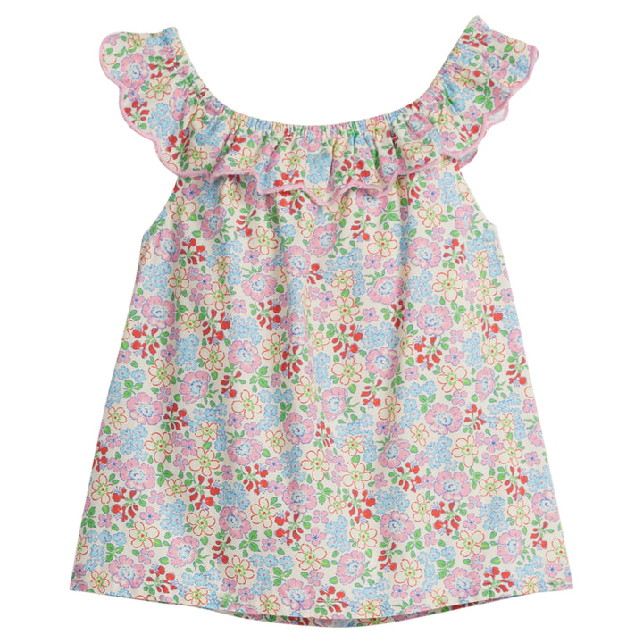 Girls/Tween woven top in a pale yellow/pink/green/red floral print. Top features a ruffle/scallop neckline that continues to the back and has a nice light pink trim. 