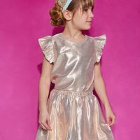 Tween skort with built in shorts and an elastic waistband in a gold metallic color paired back with a gold top featuring a single button closure at back of neck and angel sleeve detail.