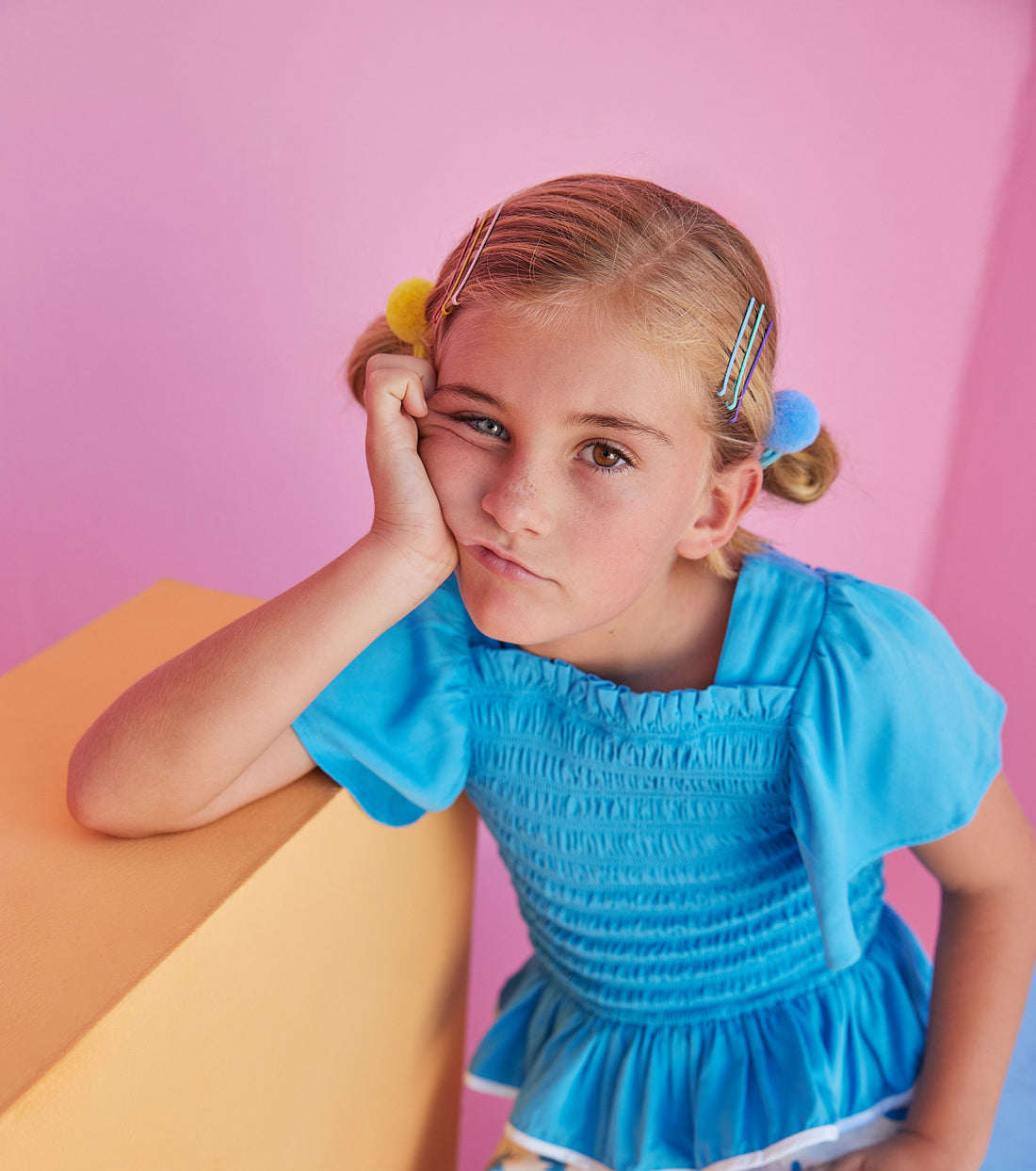 BISBY girl in our India Top in Blue which features ruching/ smocking on the body of the shirt in a super soft rayon material. Shirt is very stretchy but also form fitting and pair perfectly back with our basic shorts in Blue