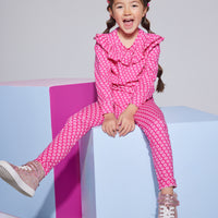 Girls/tween knit leggings in a hot pink/light pink floral print made of a super soft and stretchy material  that also feature a slight scallop/ricrac detail at ankles. Pairs back perfectly with the matching long sleeve knit top in the same print. 