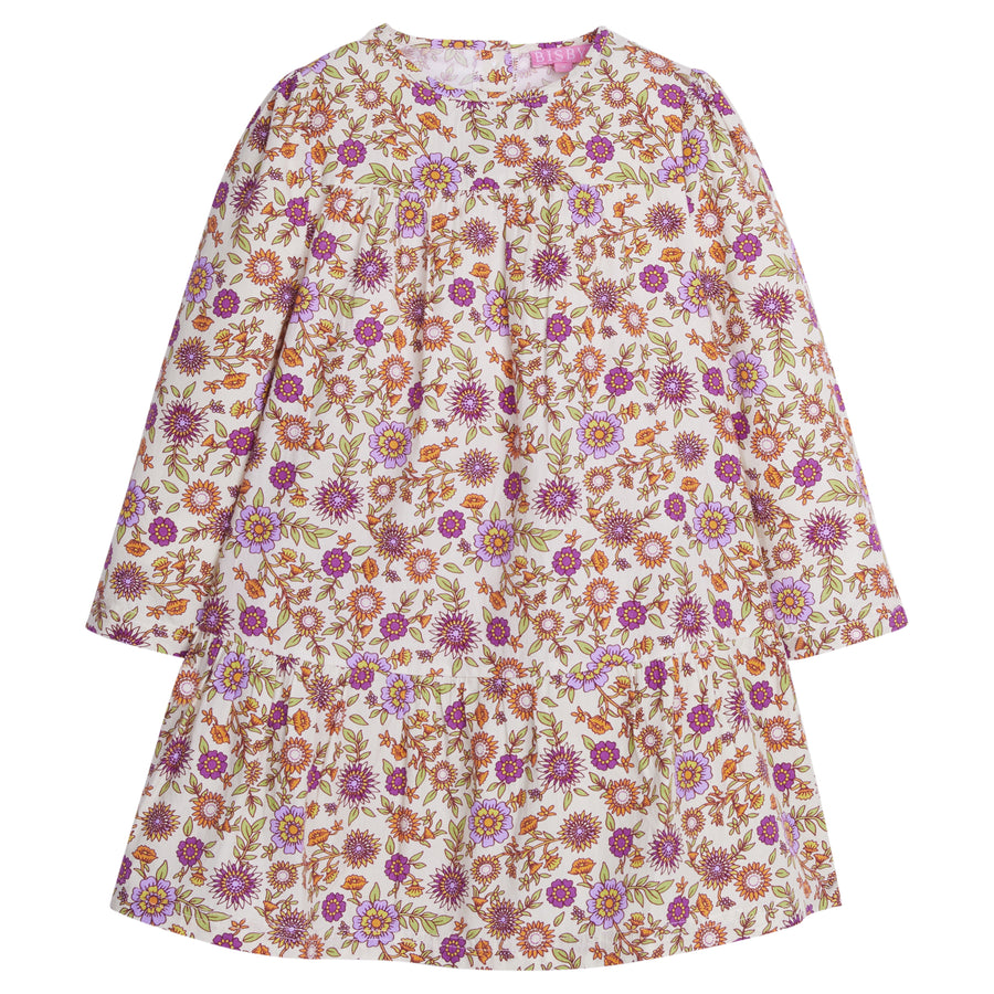 Girls/Tween woven dress in our Thistle Floral which contains an arrangement of magenta/purple/orange/and green flowers. Dress features a two-tier detail with button enclosures along the back-BISBY