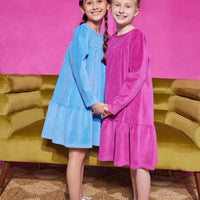 Girls/Tween velour dress in a French blue and Magenta color. Dress has button closures along the back, but made of a soft stretchy velour for a secure but comfy fit.