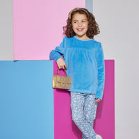 Girls/tween knit leggings in a blue/white floral print made of a super lightweight stretchy material which can be seen paired with a French blue long sleeve velour top.