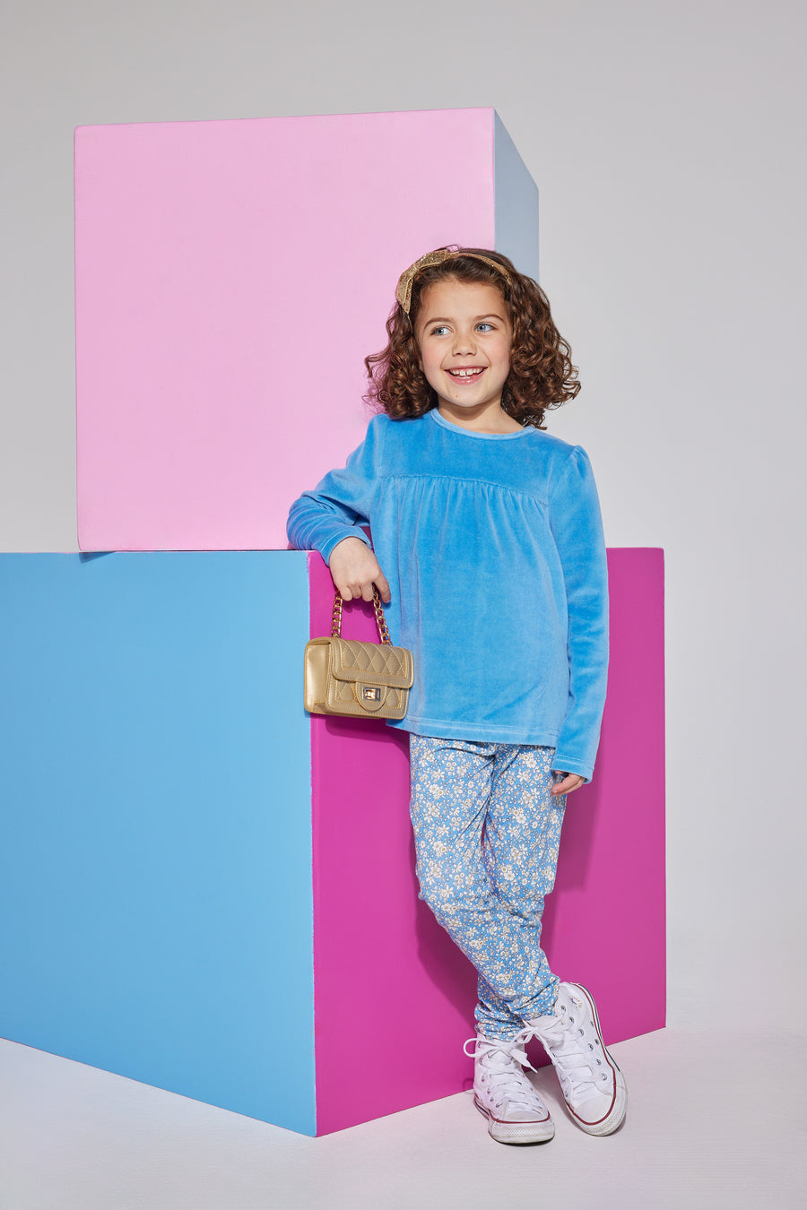 Girls/tween knit leggings in a blue/white floral print made of a super lightweight stretchy material which can be seen paired with a French blue long sleeve velour top.