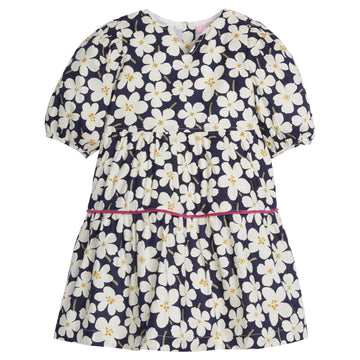 Girls/Tween woven slightly v-neck dress in our Navy Blooms pattern which features large white flowers on a navy background. Dress also has a hot pink trim detail around the bottom tier for a pop of color. There are button enclosure along back and puff sleeves for a comfy fit-BISBY