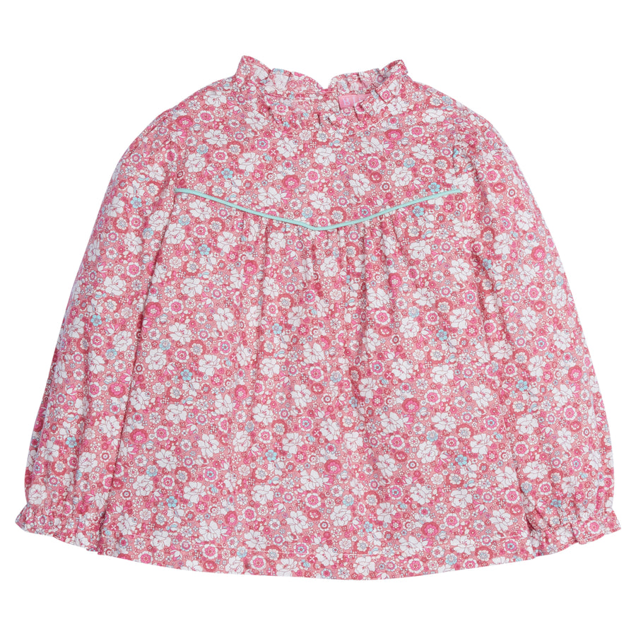 Girls/Tween top in our Bedford Gardens Pink floral which features a pink/turquoise/white floral arrangement. Top has a turquoise trim detail along the bust, elastic cuffs on the sleeves, ruffles at the neckline, and there are buttons along back as well -BISBY