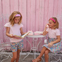 BISBY girl in our Rosie Dress in Tulip Garden. Top half of dress is a knit white and pink stripe and bottom half has a beautiful woven colorful floral.  To match, pair your other BISBY girl in our Angel Sleeve Tee in pink and white stripe paired with our matching Tulip Garden Shorts (Rosie Short Set)