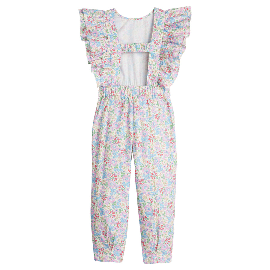 Girls/Tween woven jumpsuit that features ruffle detail along the front/sleeves, pockets, and a front tie with an open back. Jumpsuit has a beautiful pale yellow/pink/green/blue floral pattern and is a lightweight woven material for ultimate comfort. 