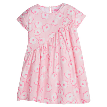 Girl/Tween woven dress in light pink/hot pink/white floral print. This fun dress has a "swoop" ruching detail along the front side for a different/ fun shape. Dress also has a button closure at back for a secure but relaxed fit.